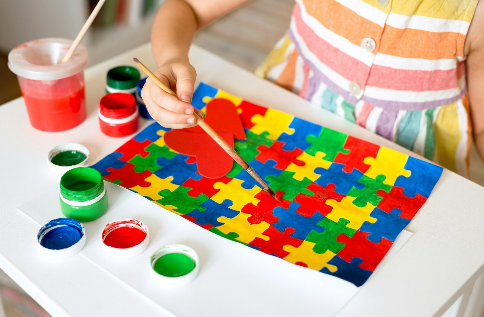 Drawing of multi-colored puzzles - a symbol of Autism Day